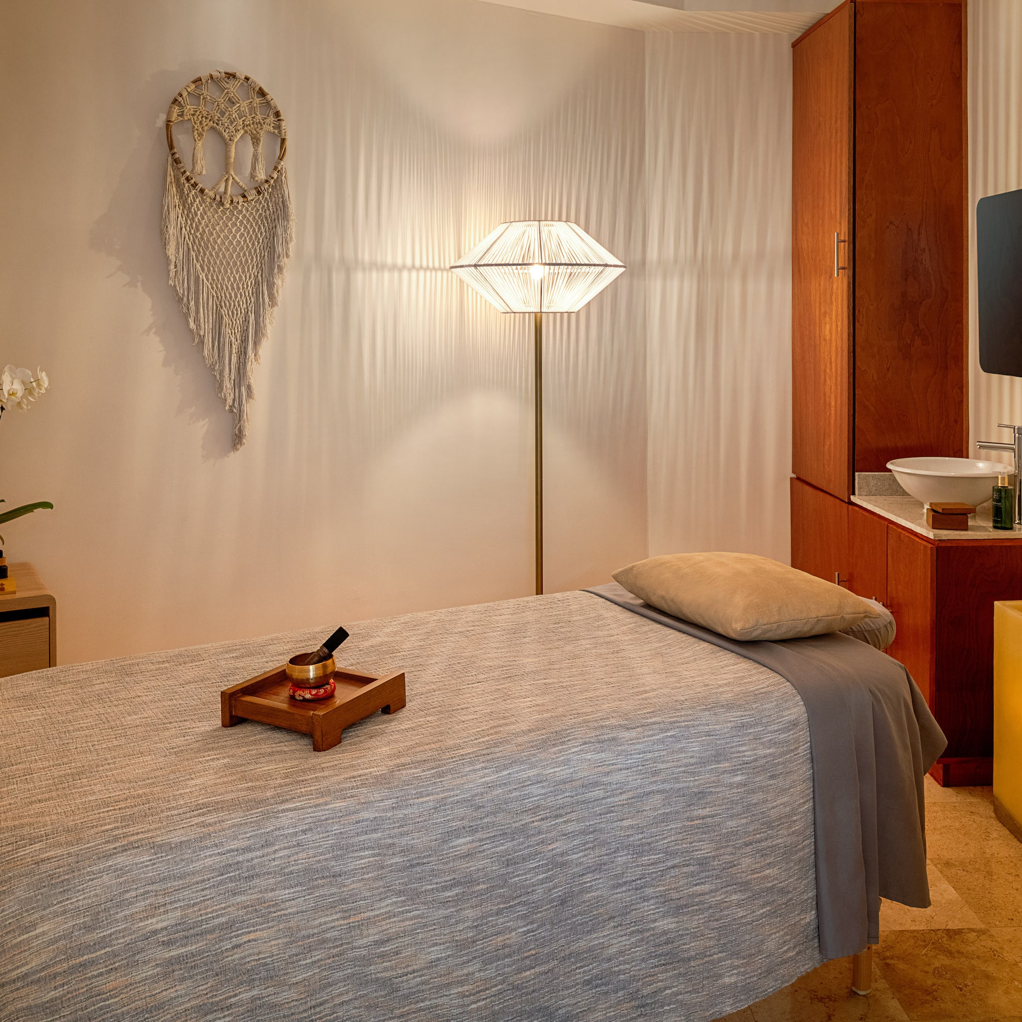 a room with a bed and a mirror