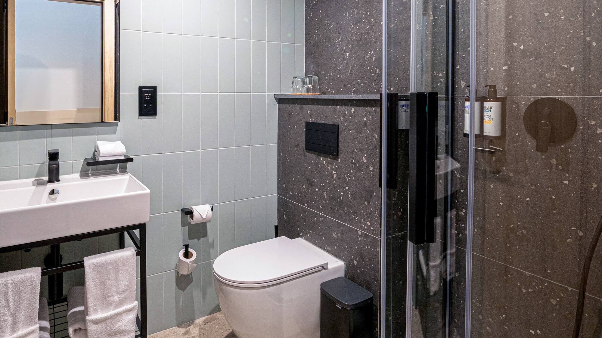 a bathroom with a shower and sink