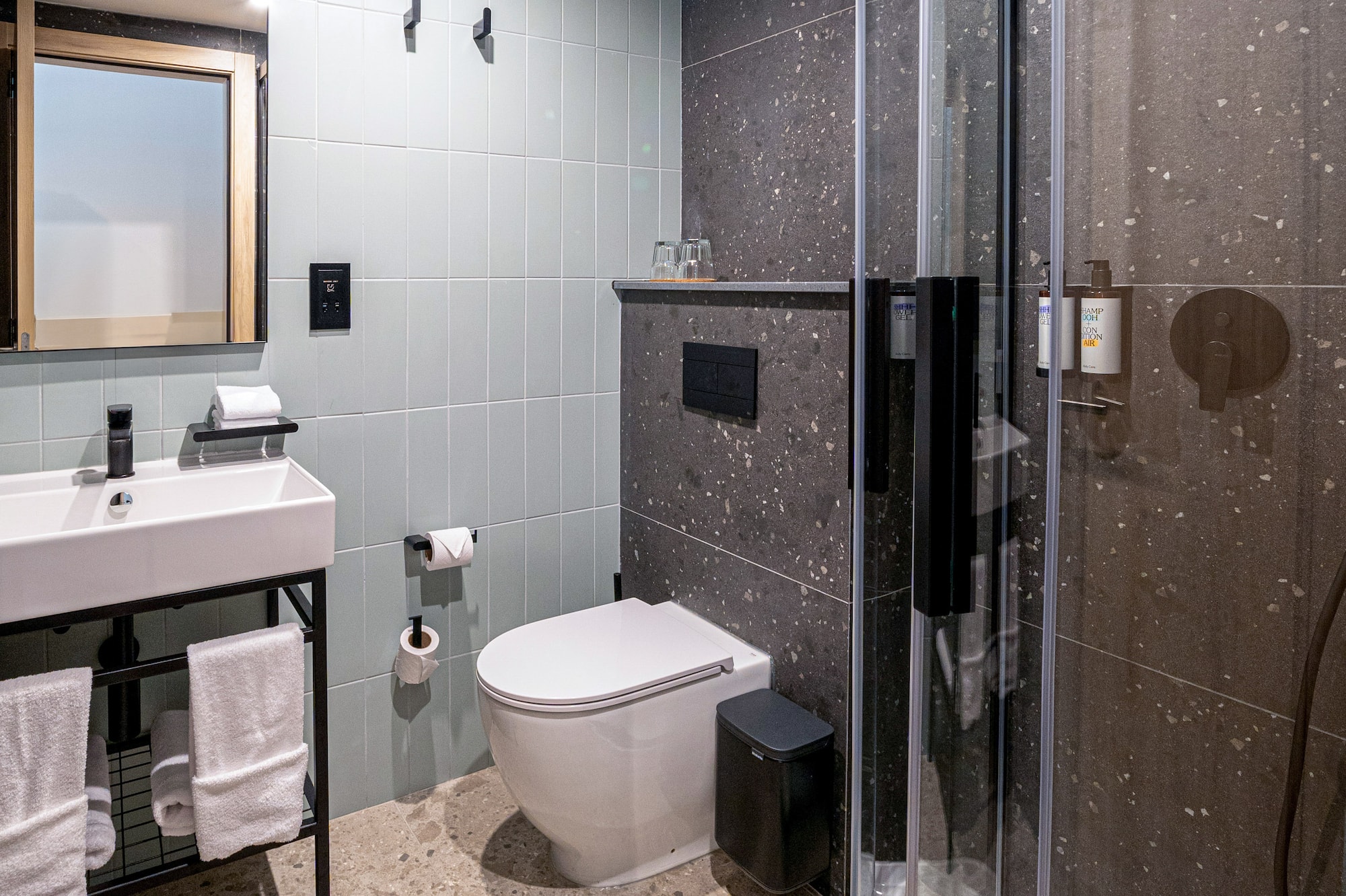 a bathroom with a shower and sink