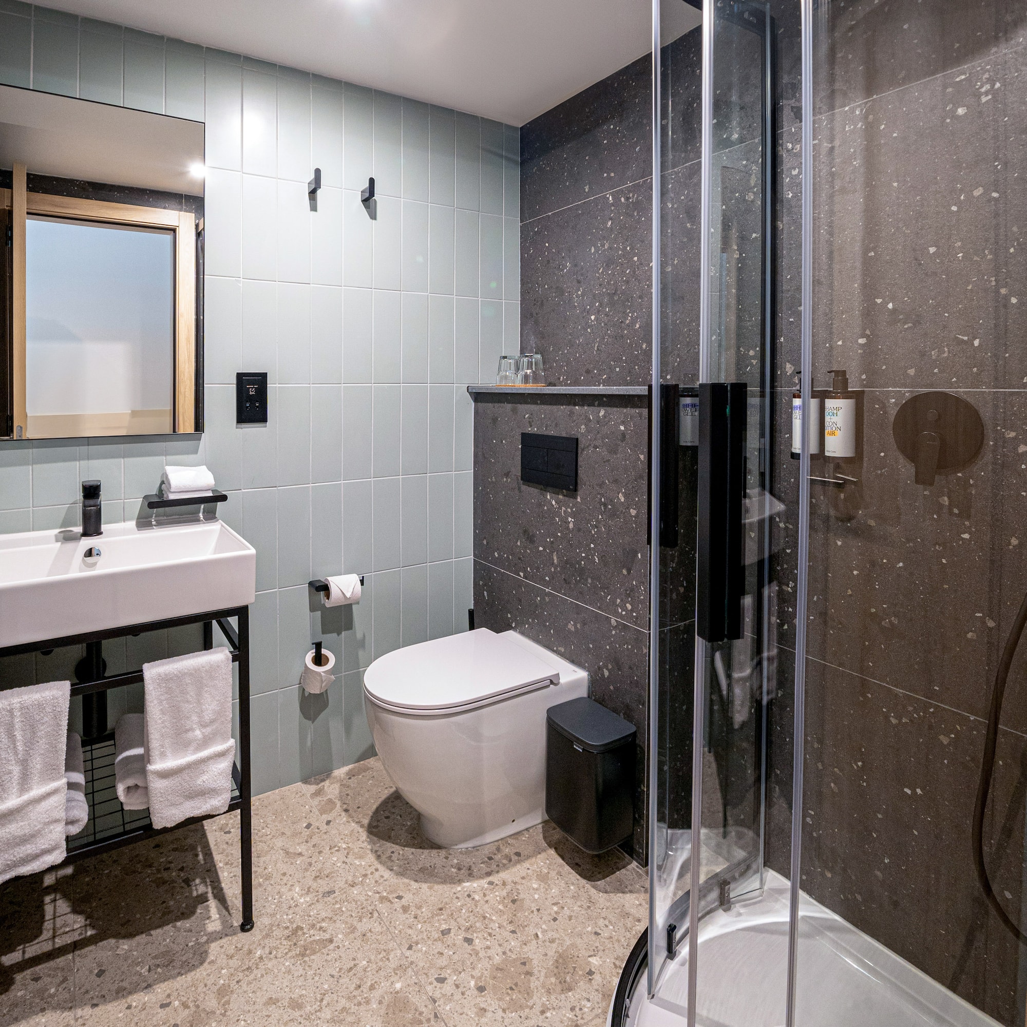 a bathroom with a shower and sink