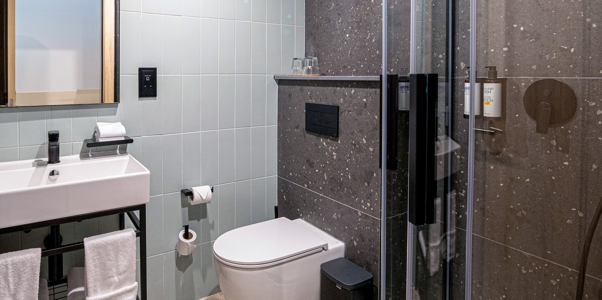 a bathroom with a shower and sink