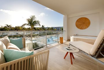 a balcony with a pool and a couch