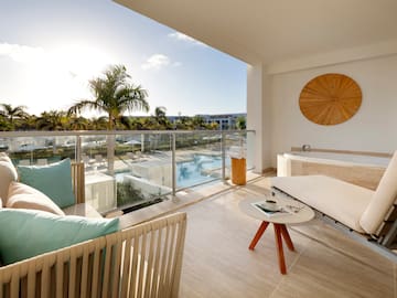 a balcony with a pool and a couch