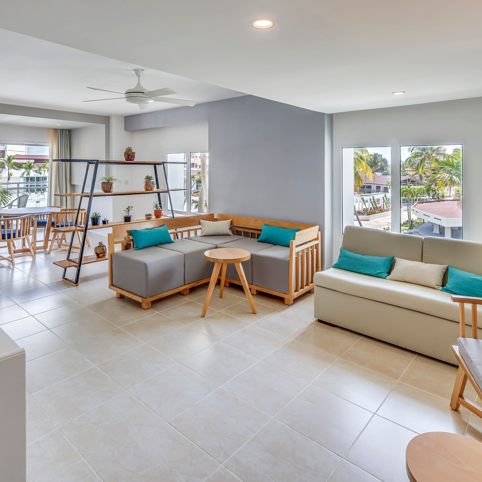 a living room with couches and tables
