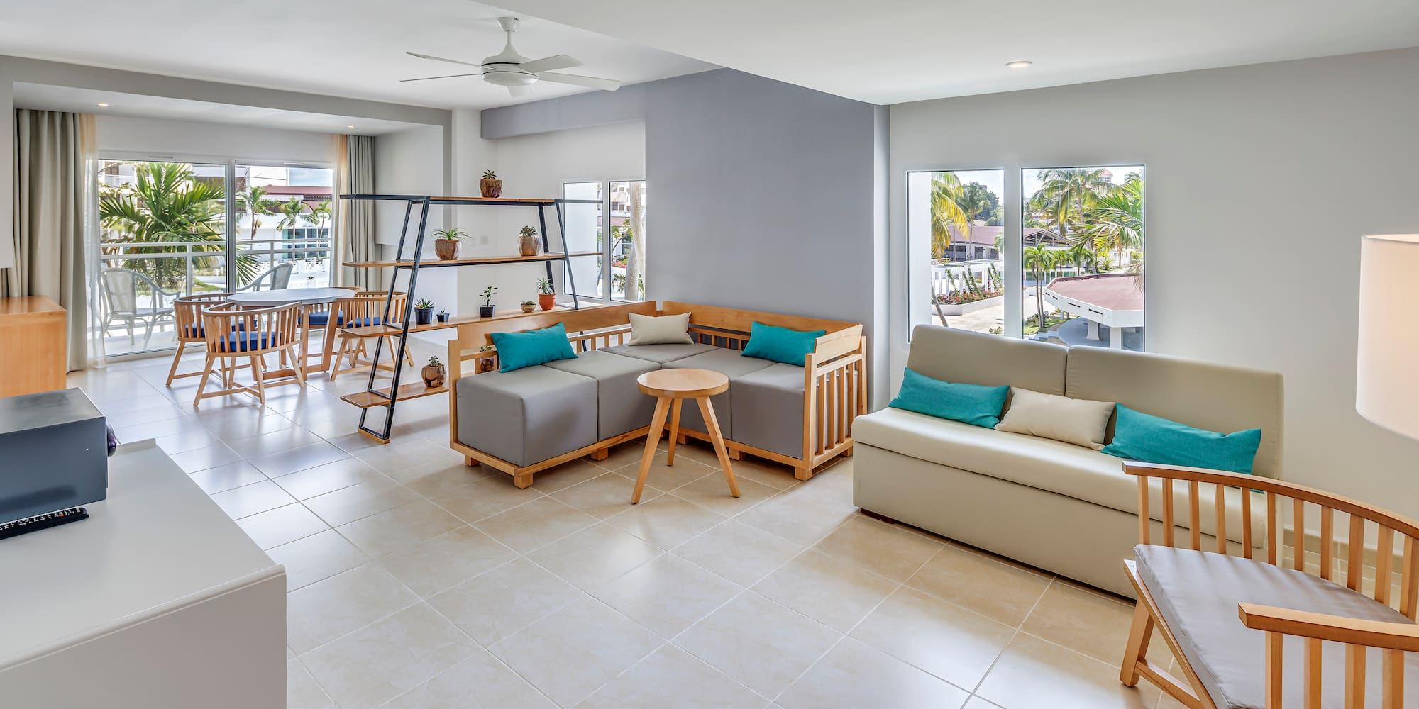 a living room with couches and tables