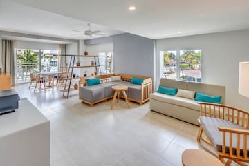 a living room with couches and tables