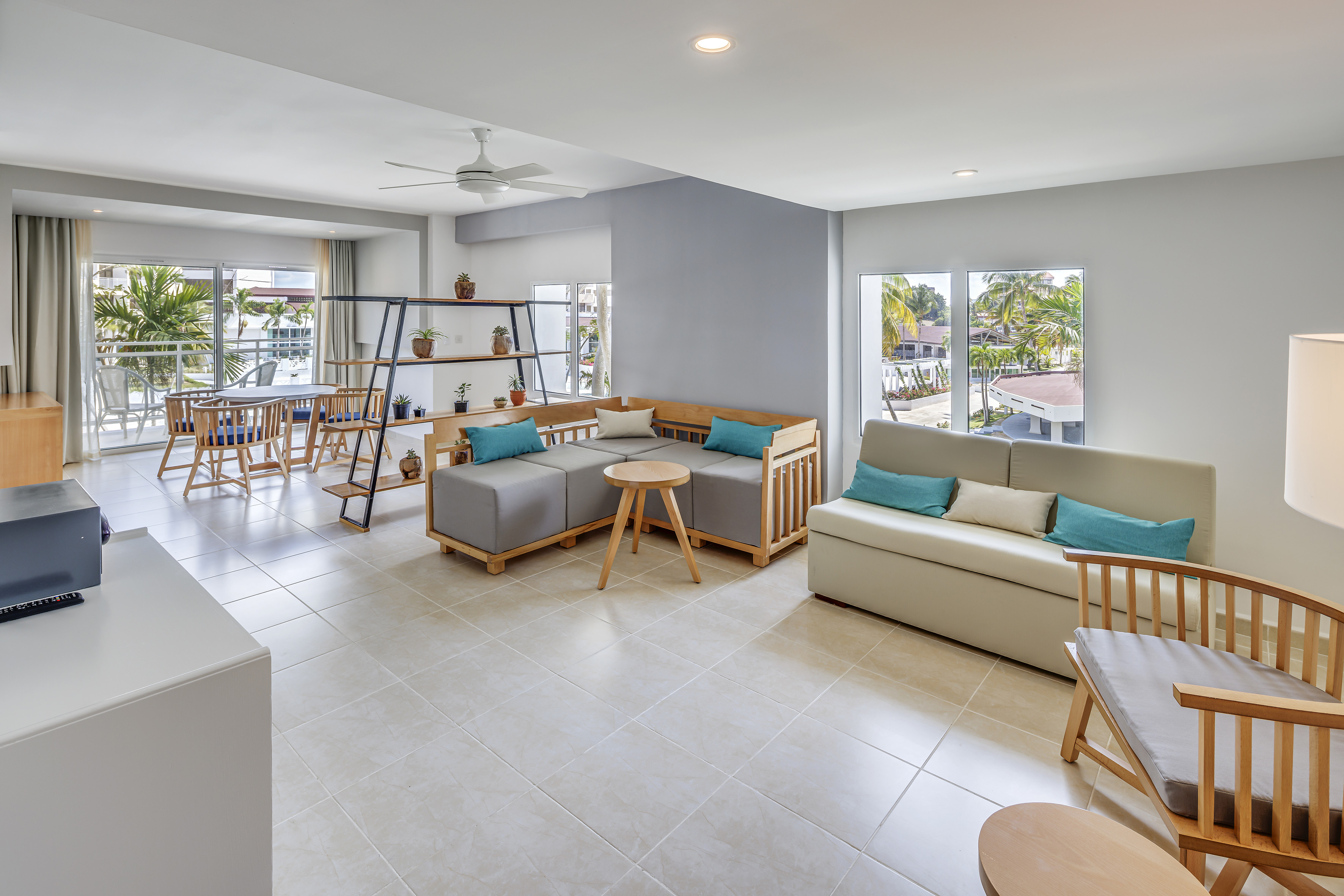 a living room with couches and tables