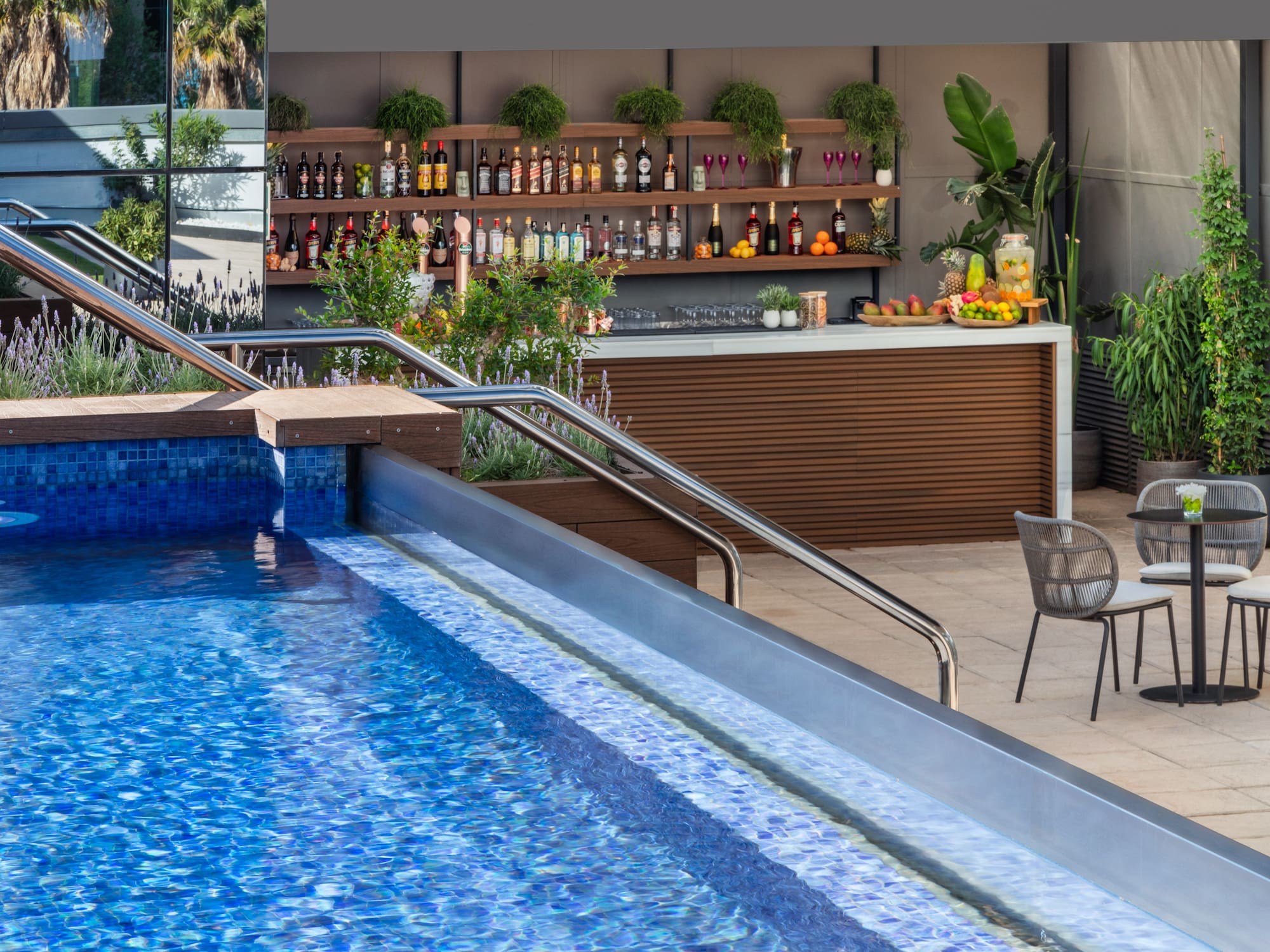 a pool with a bar and shelves of drinks