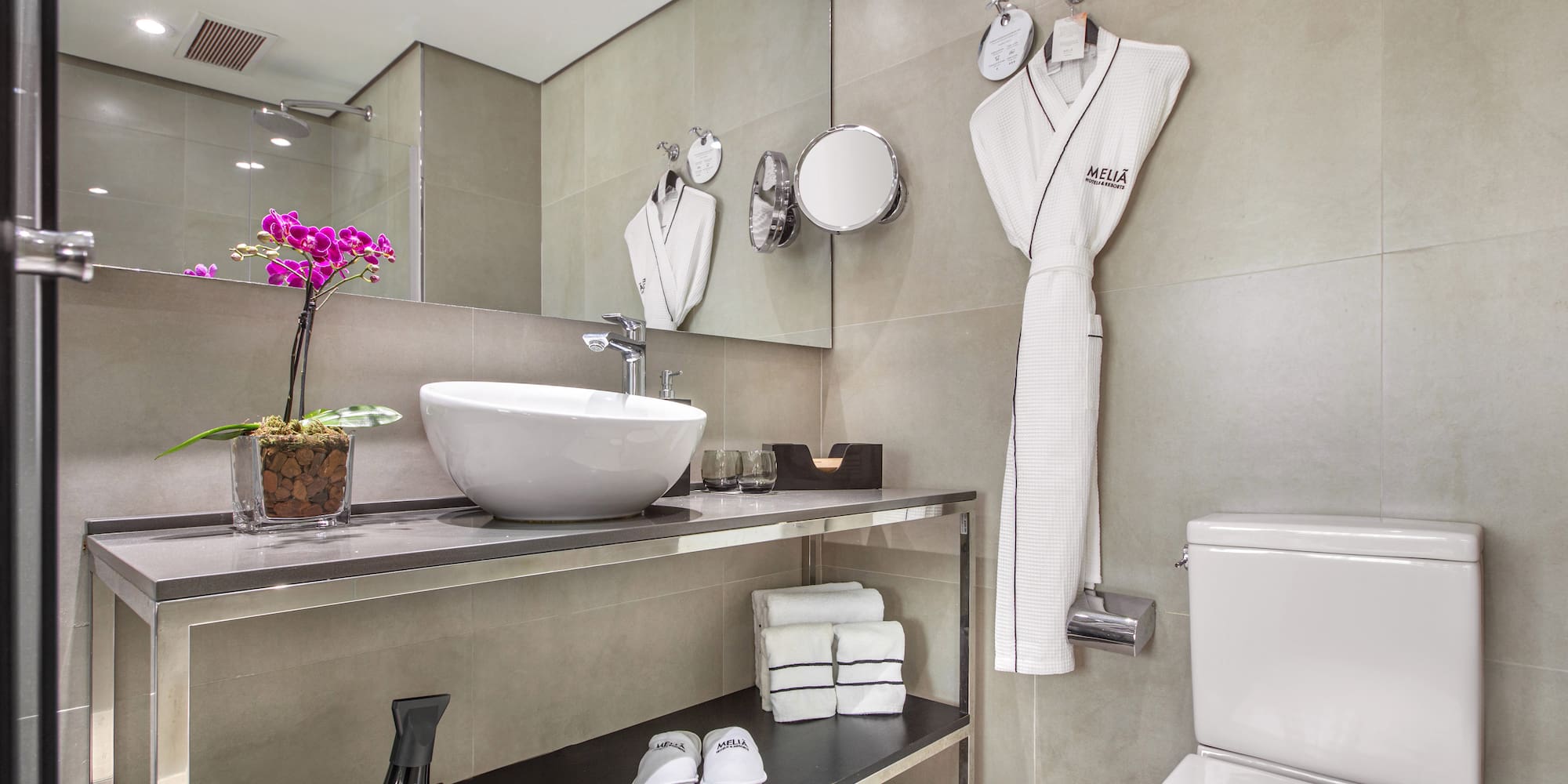 a bathroom with a sink and a towel rack