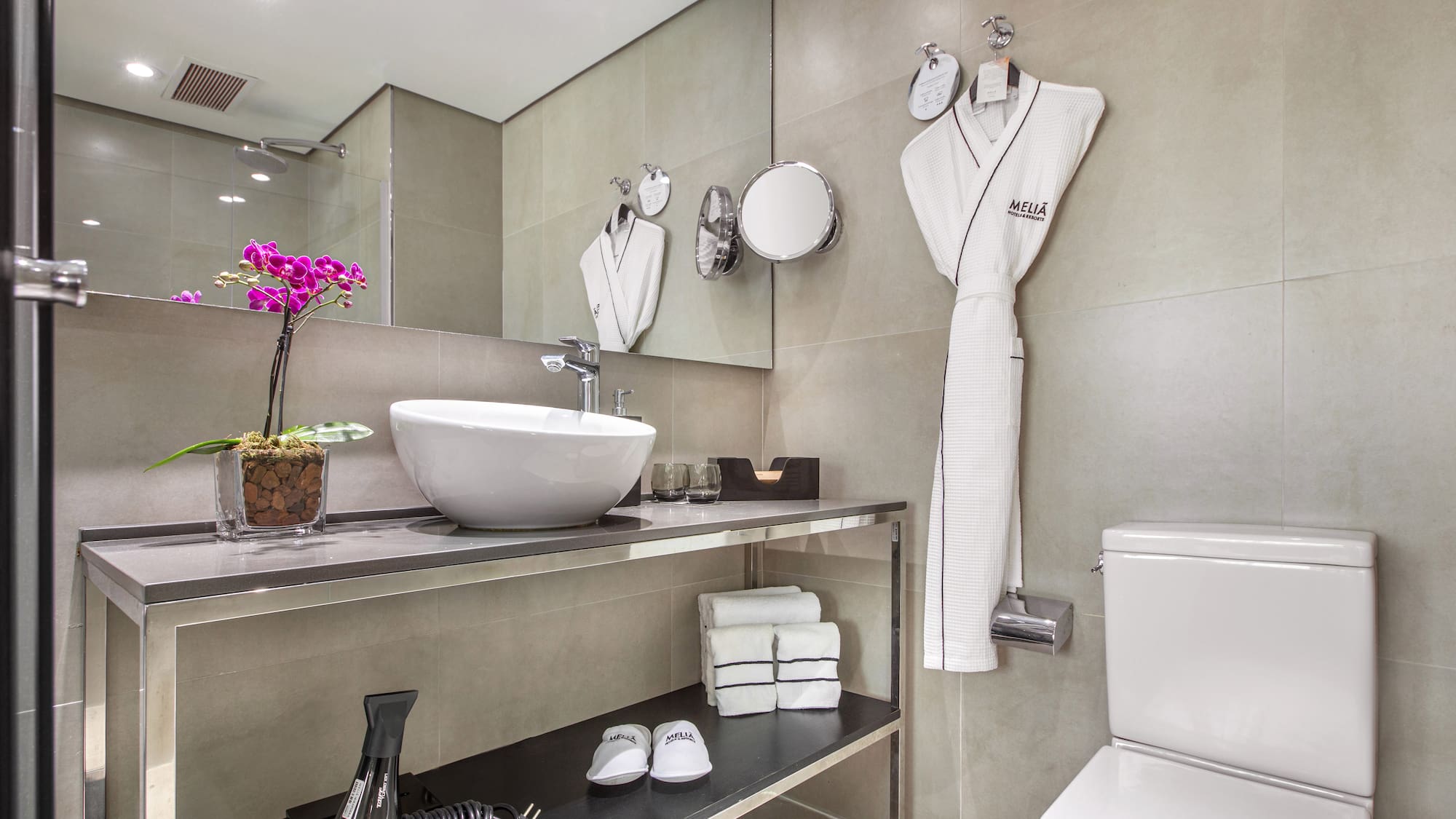 a bathroom with a sink and a towel rack