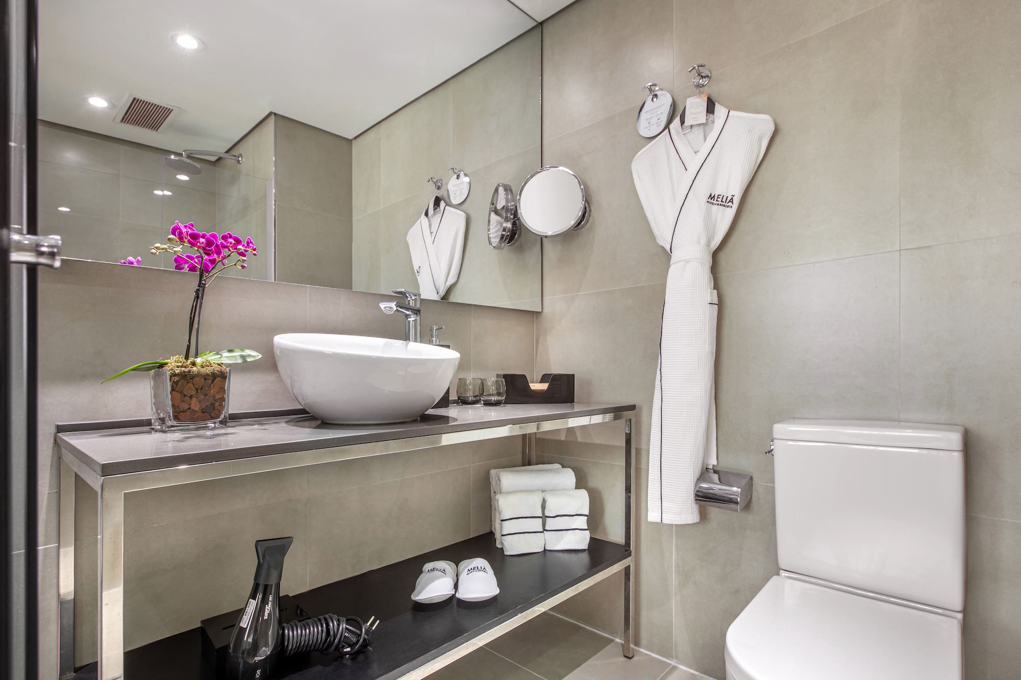 a bathroom with a sink and a towel rack