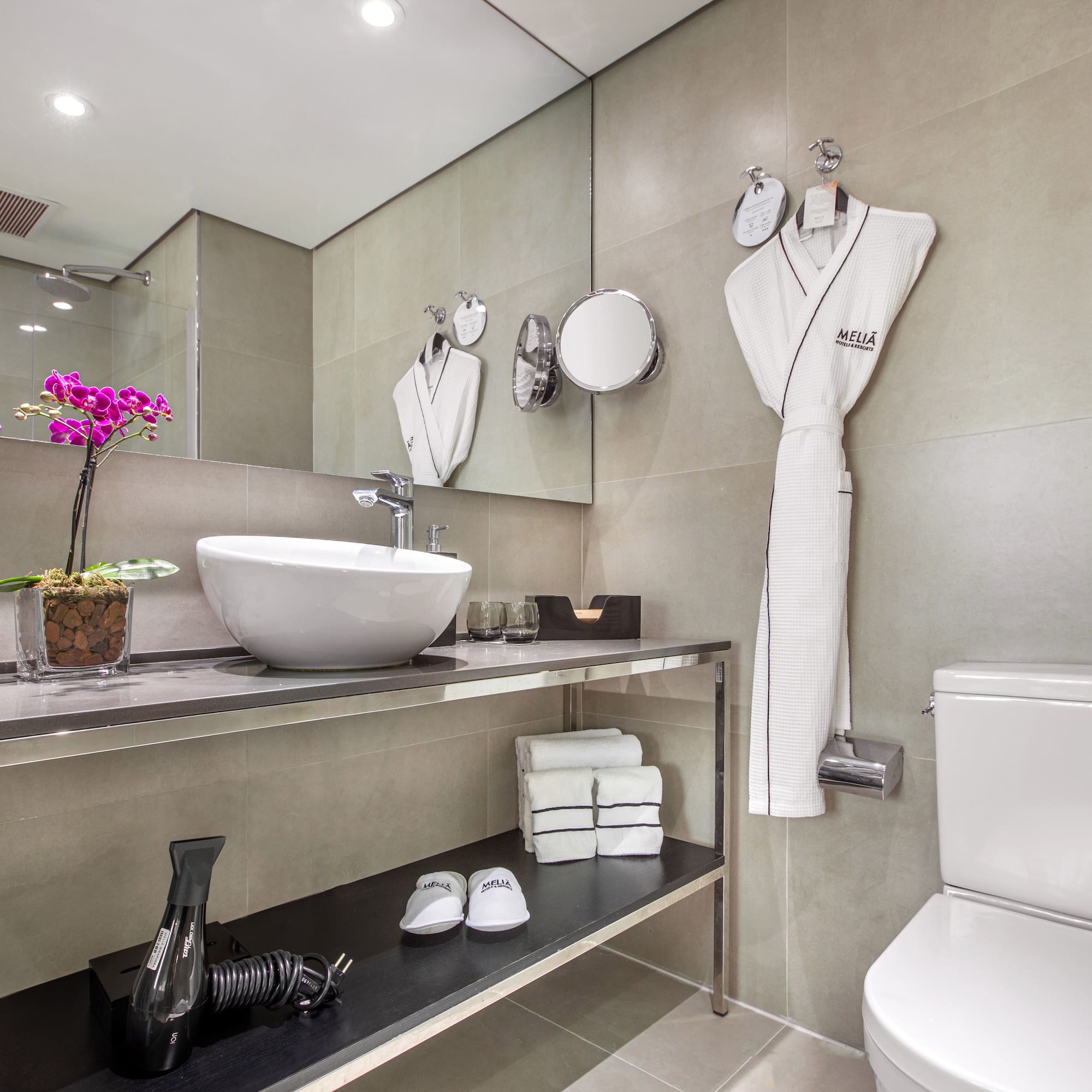 a bathroom with a sink and a towel rack