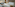 a room with a bed and a window
