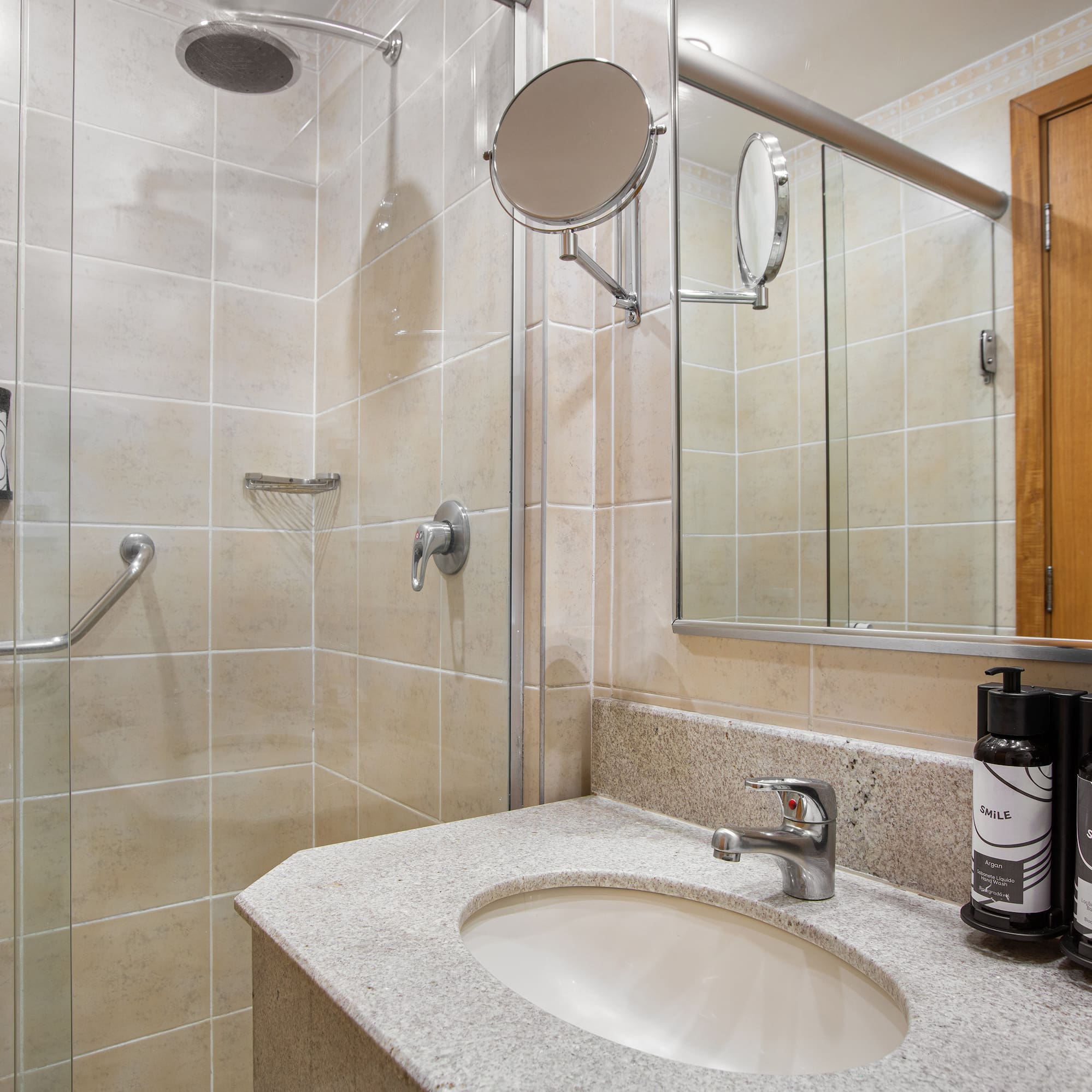 a bathroom with a shower and a sink