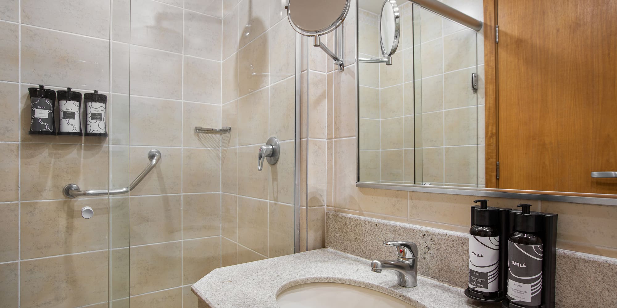 a bathroom with a shower and a sink
