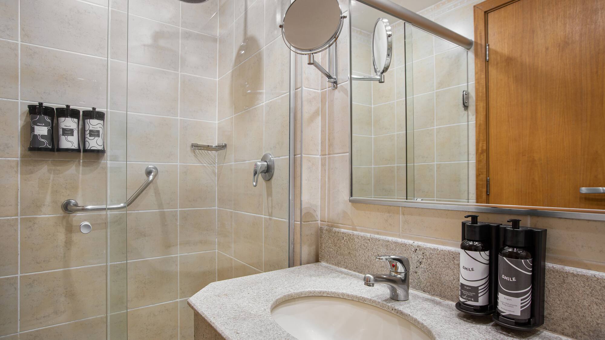 a bathroom with a shower and a sink