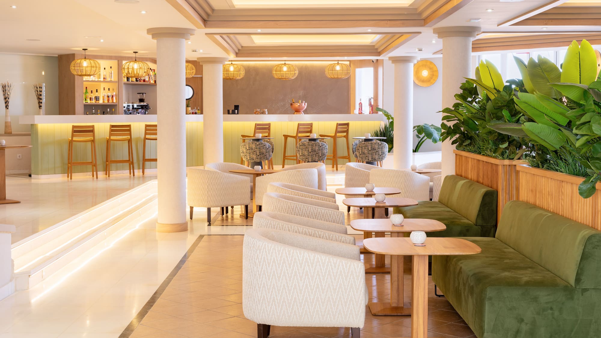 Modern hotel bar lounge with sleek design, various seating, and warm lighting.