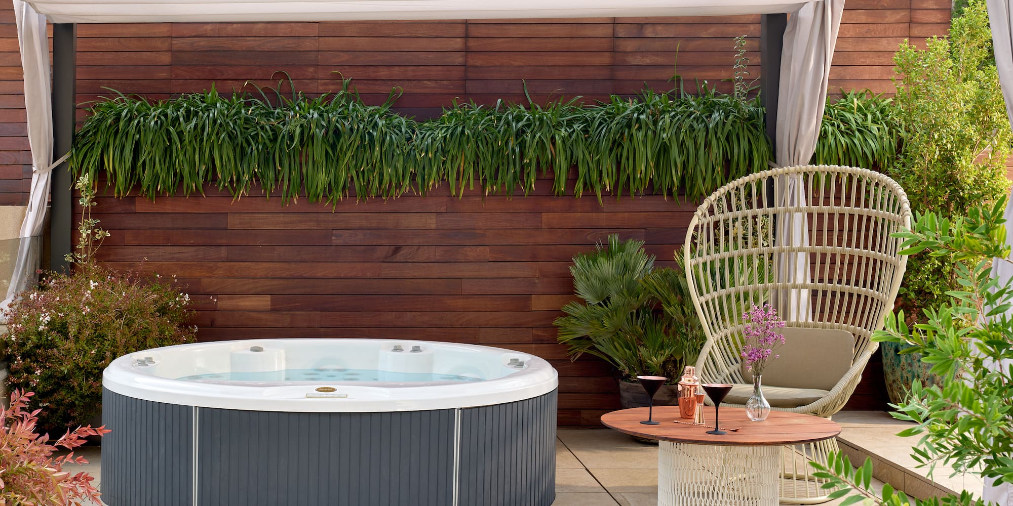 a hot tub and a chair on a patio