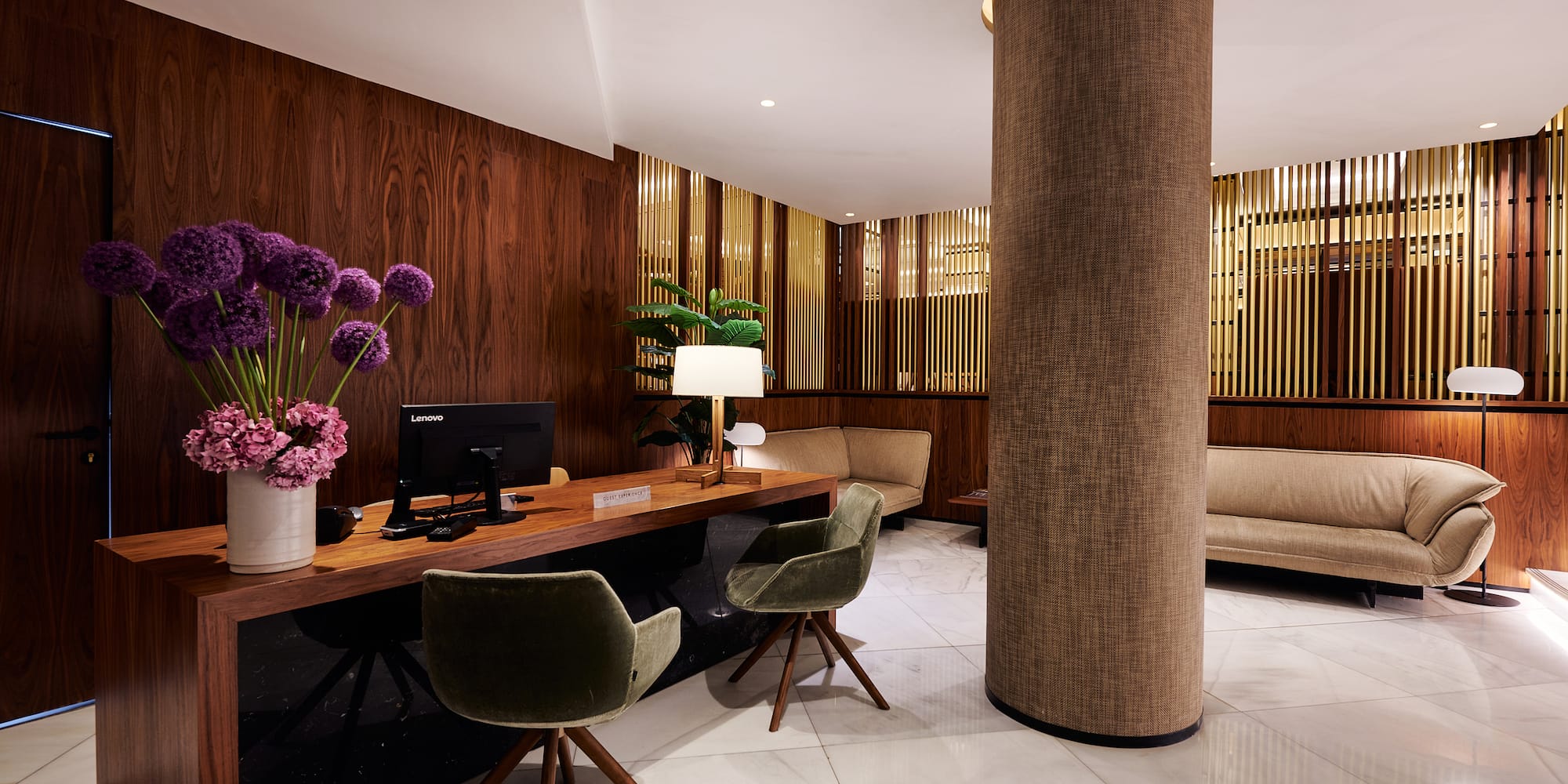 a room with a desk and chair and a couch