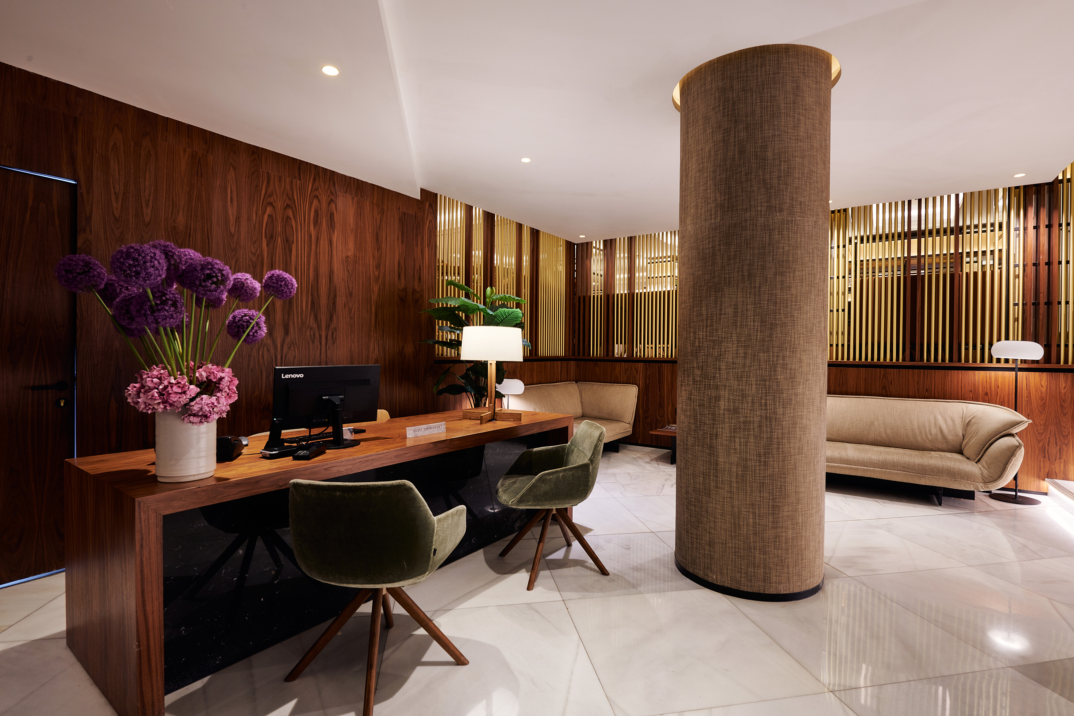 A room with a desk, a chair, and a couch.