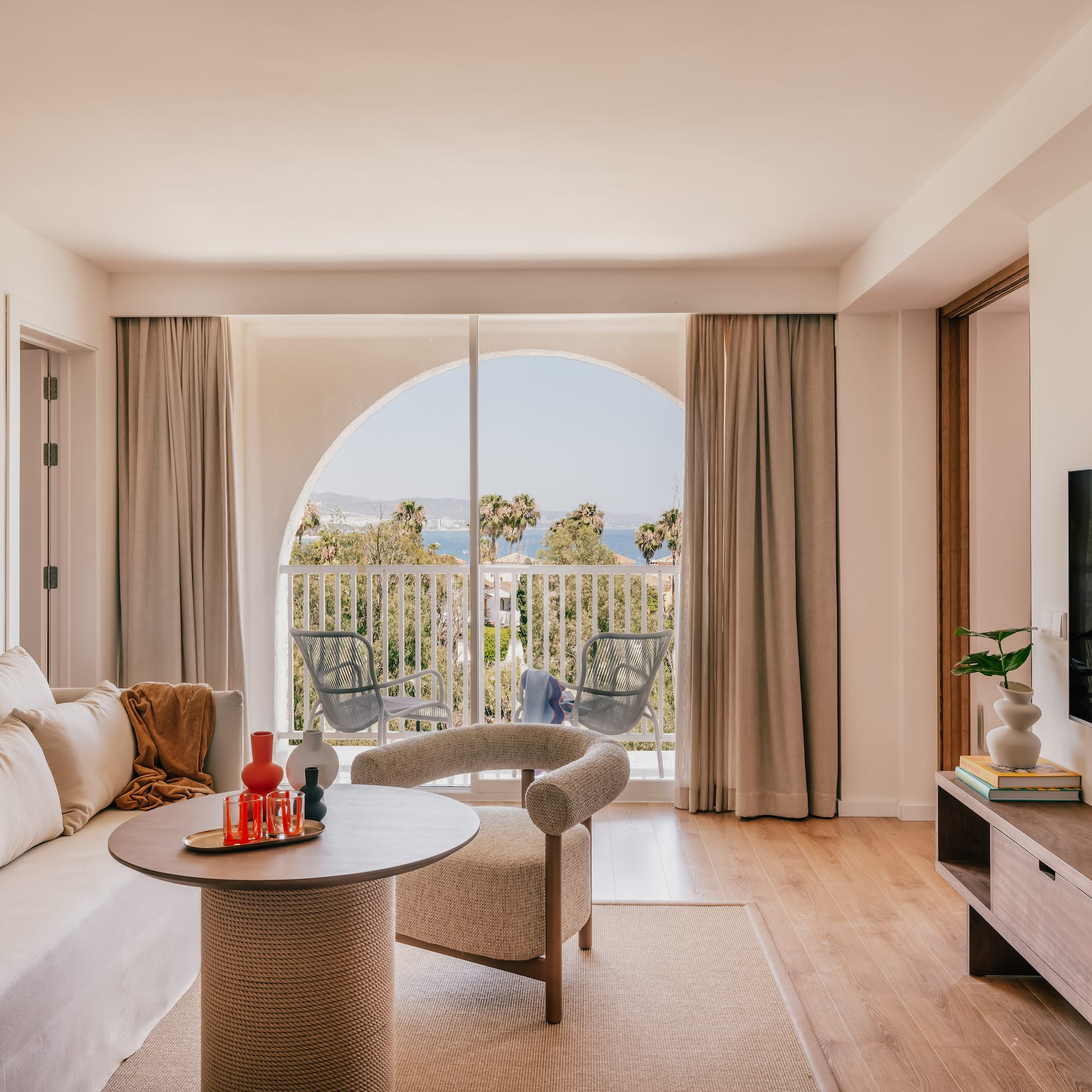 a living room with a television and a couch