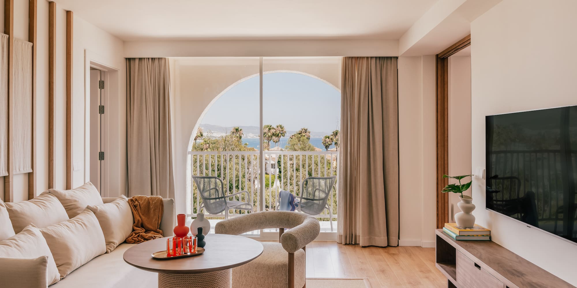 a living room with a television and a couch