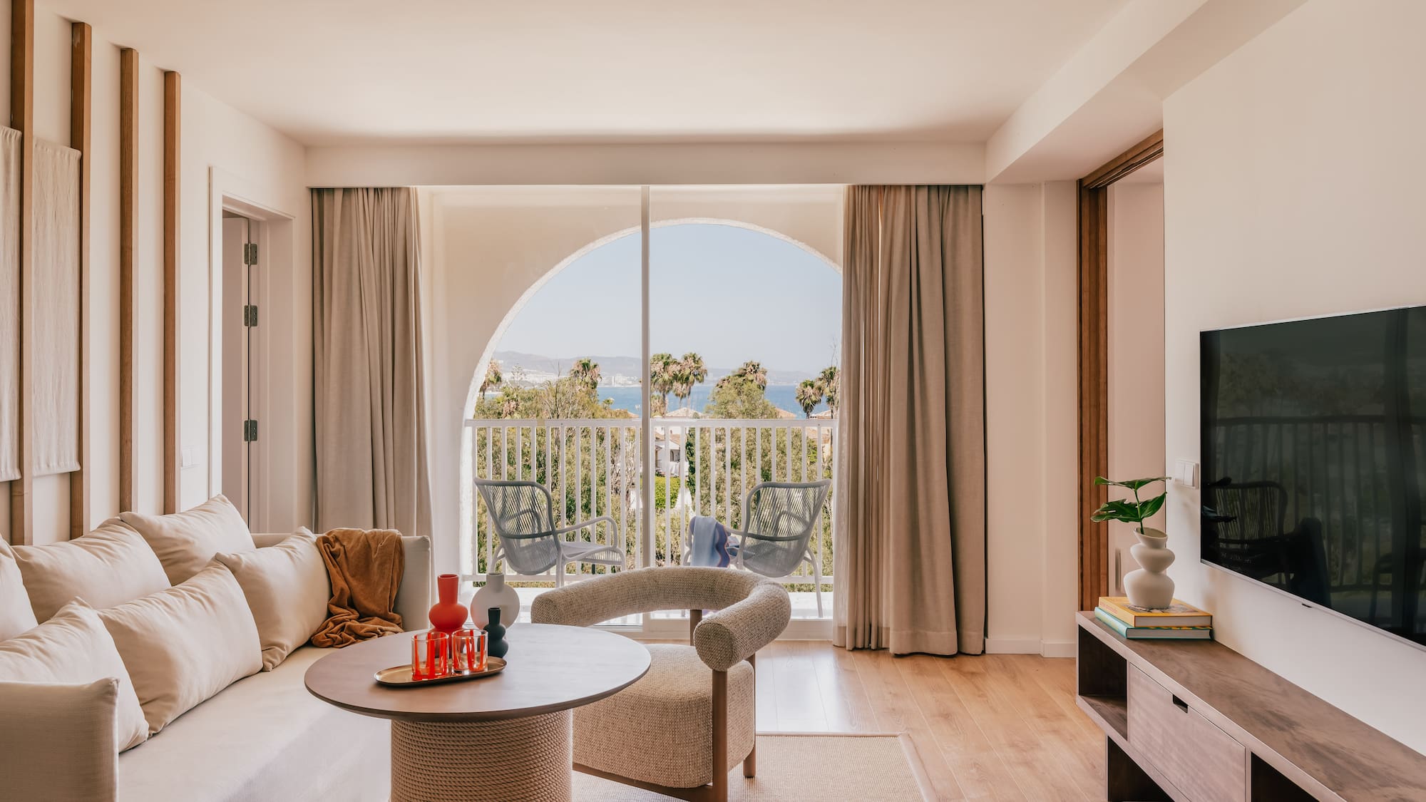 a living room with a television and a couch