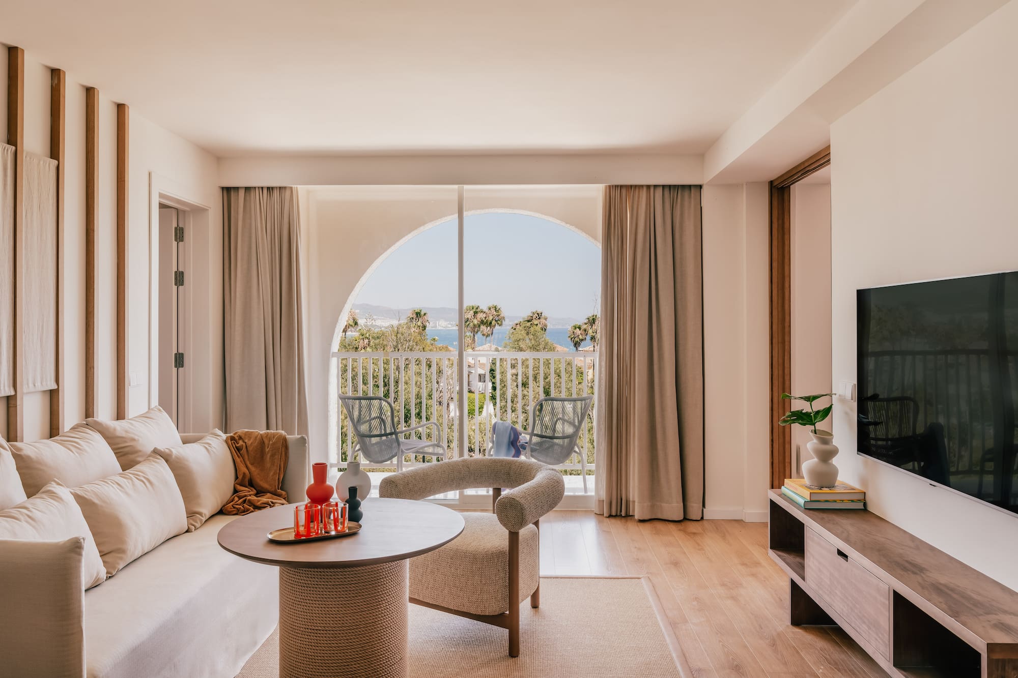 a living room with a television and a couch