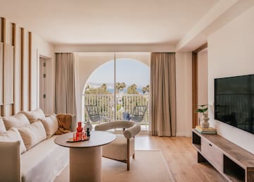 a living room with a television and a couch