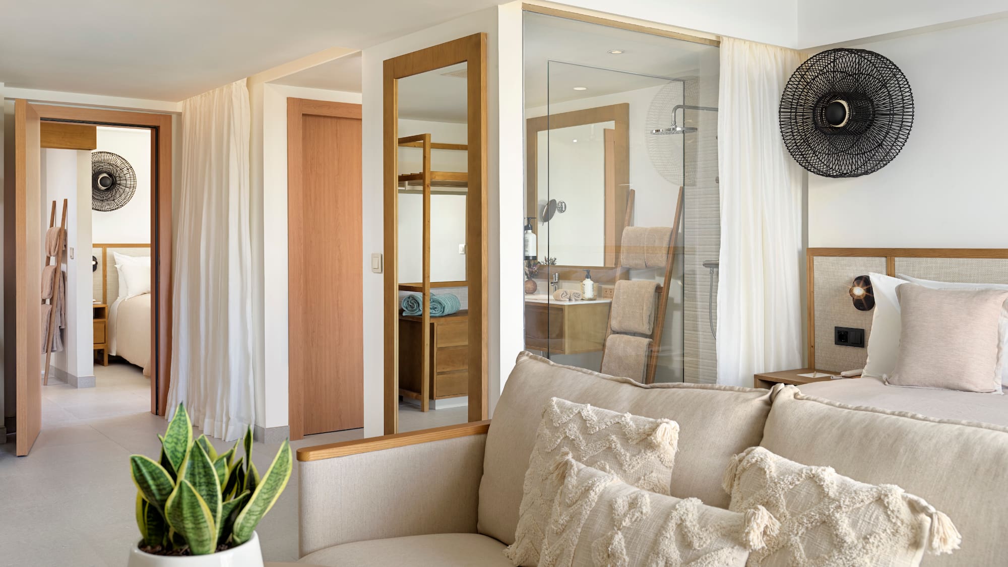 a room with a couch and a plant