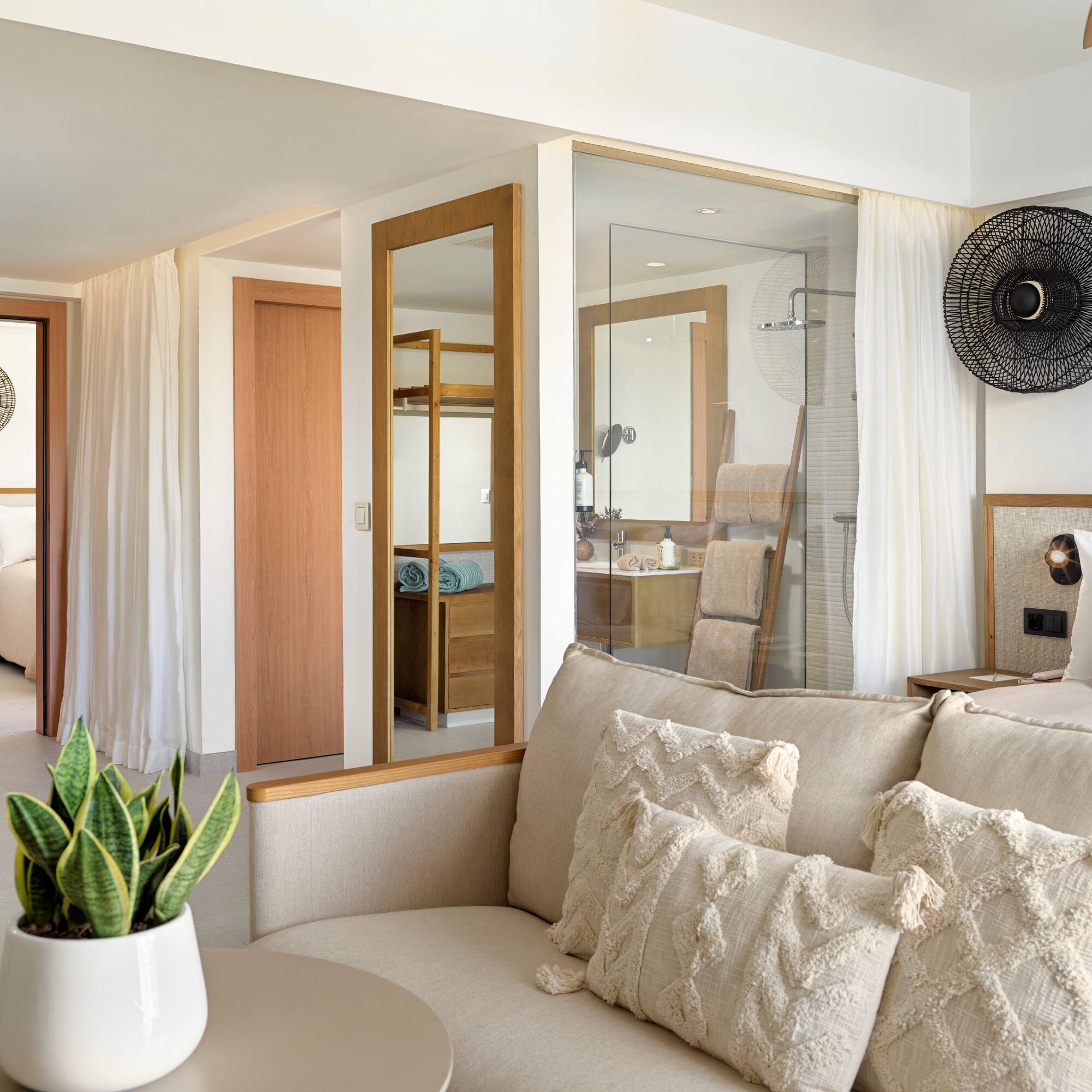 a room with a couch and a plant