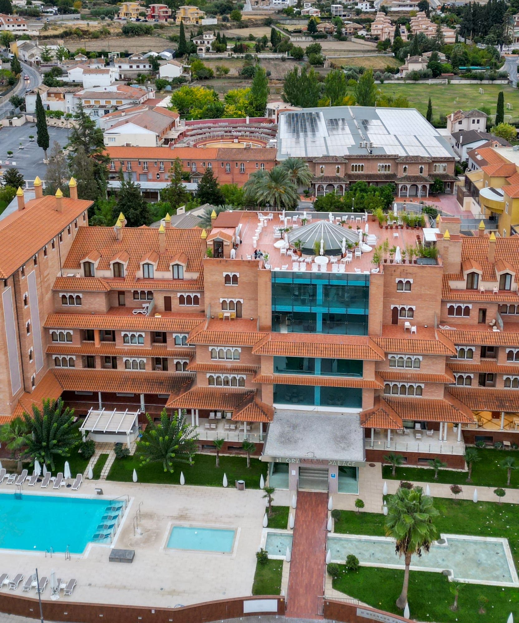 a large building with a pool in the middle