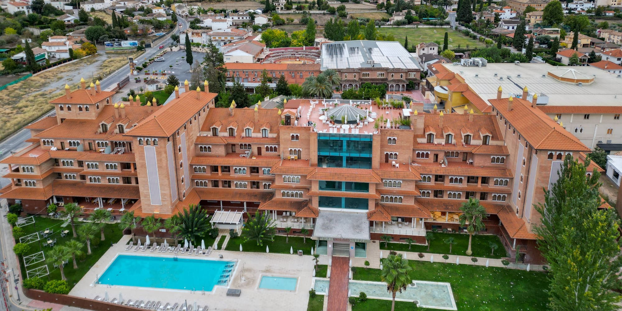 a large building with a pool in the middle