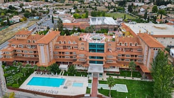 a large building with a pool in the middle
