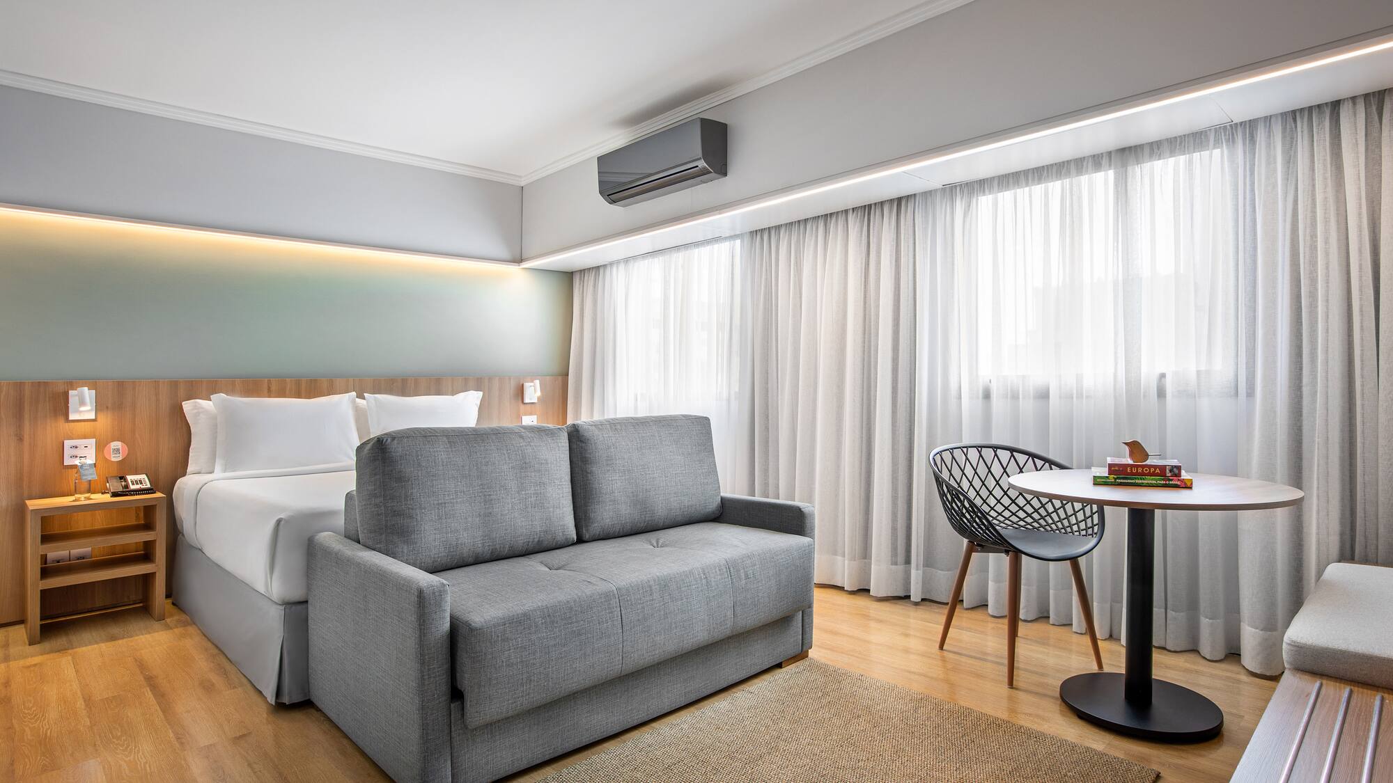 a room with a bed and a table