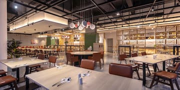 a restaurant with tables and chairs