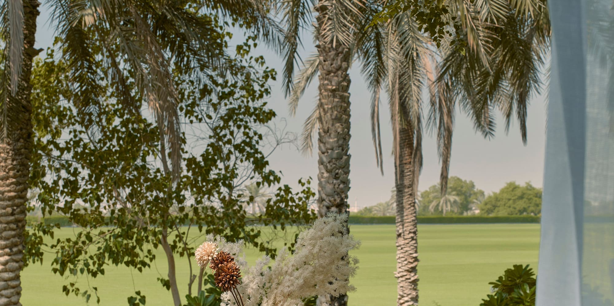 a table with food on it and a glass vase on it