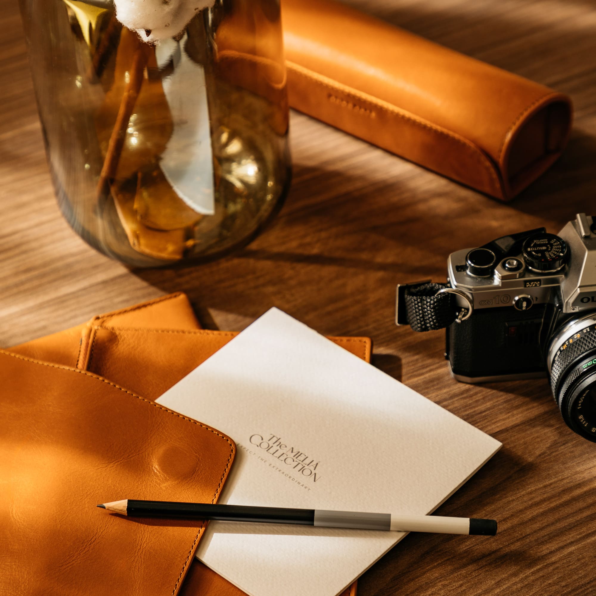 a pencil and a pen on a table