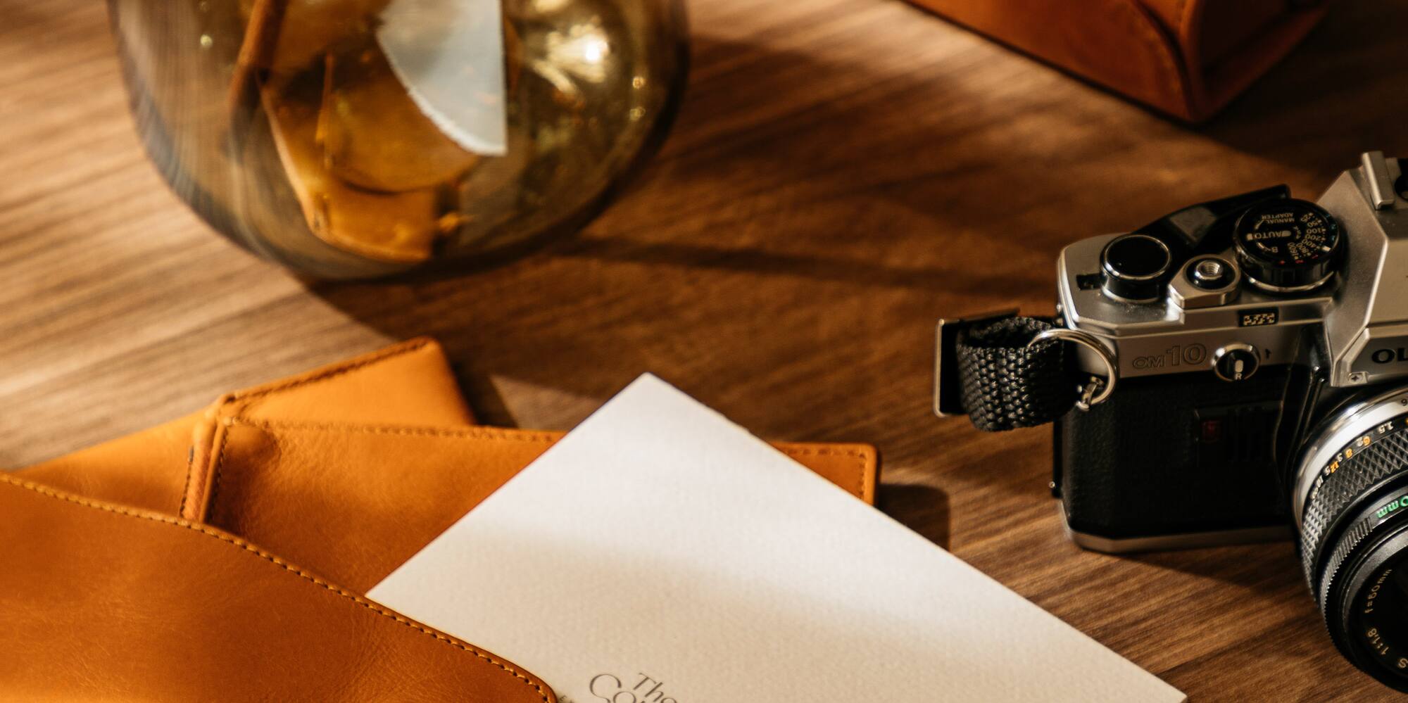 a pencil and a pen on a table