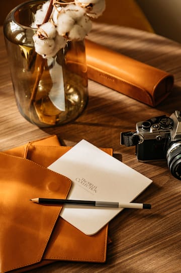 a pencil and a pen on a table