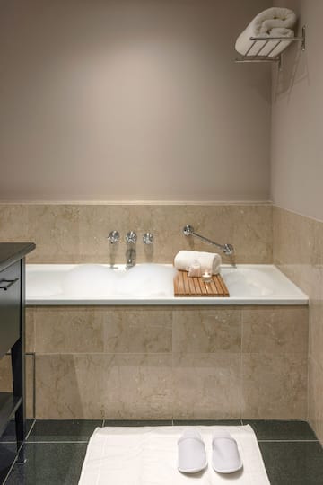 a bathtub with a towel on it