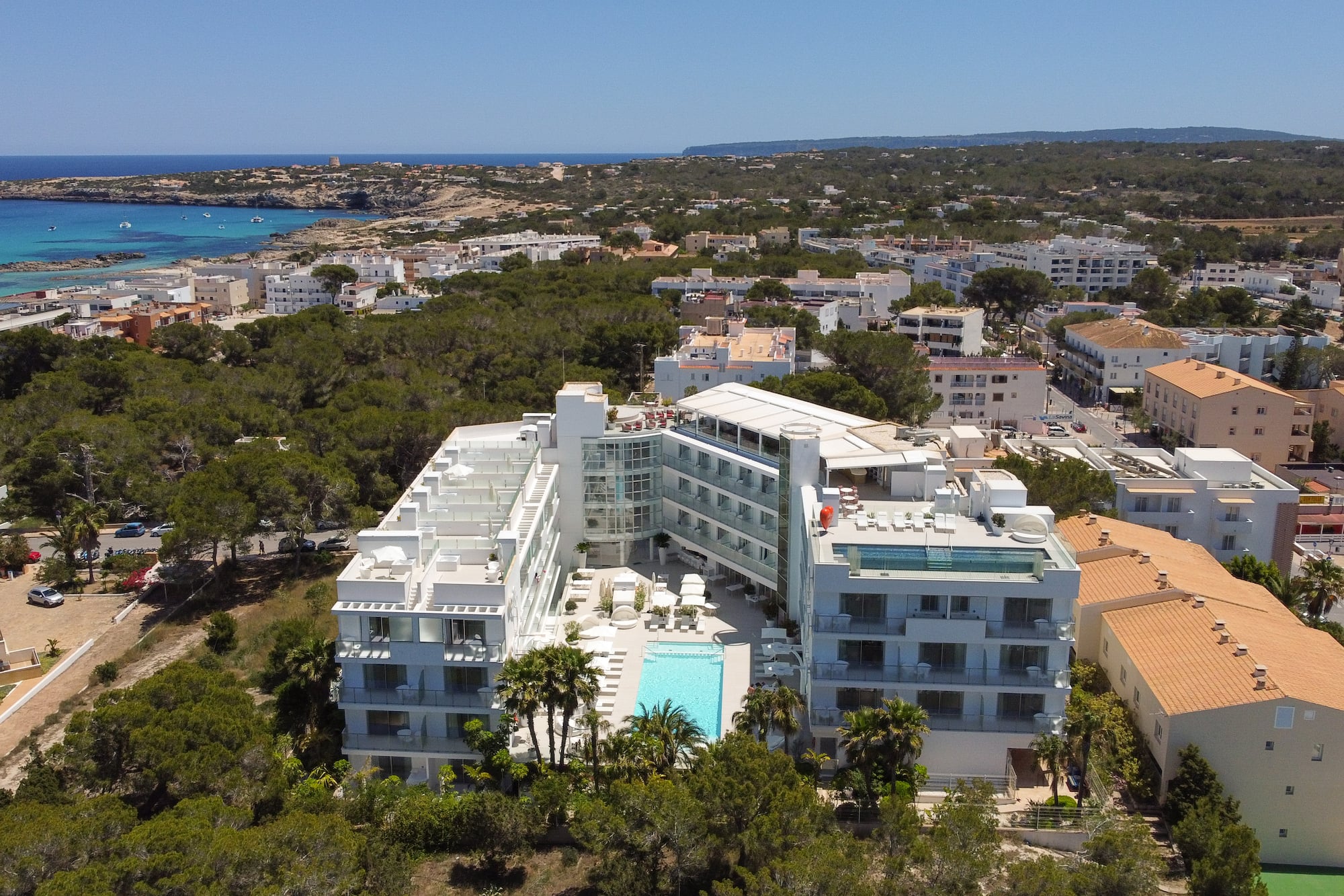 a building with a pool in the middle of a city