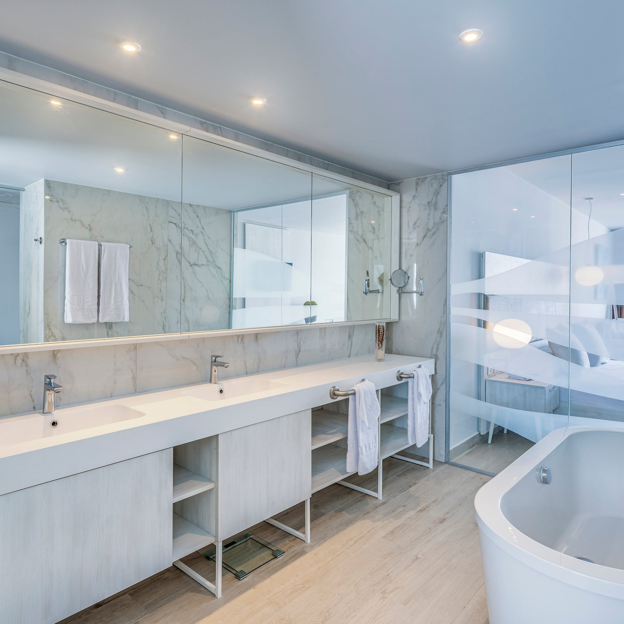 a bathroom with a tub and sink