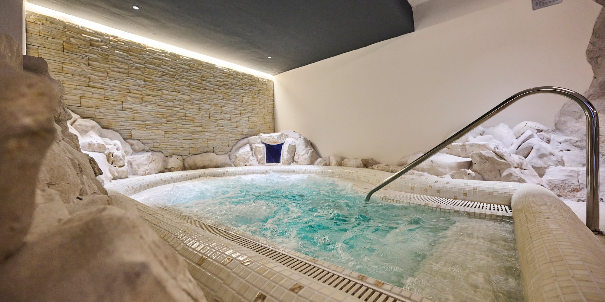 a indoor jacuzzi with a hot tub