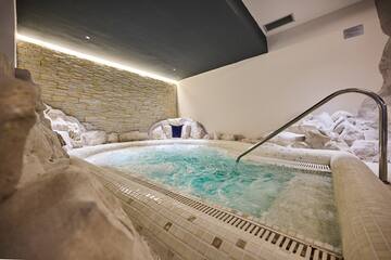 a indoor jacuzzi with a hot tub