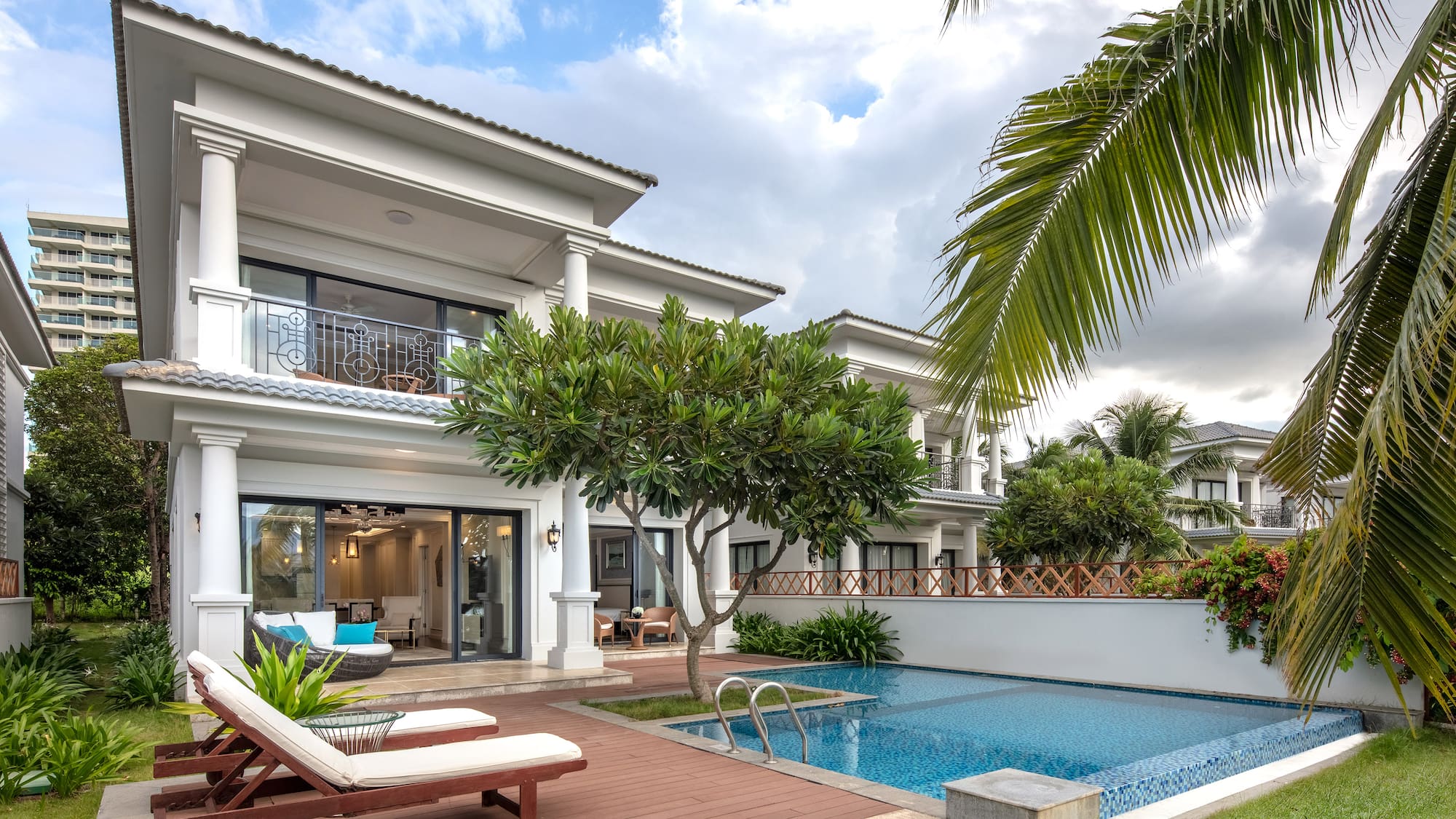 a pool in front of a house