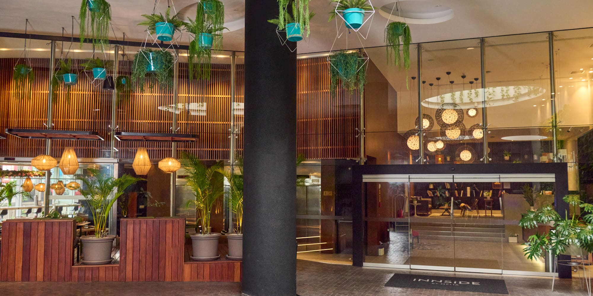 a building with plants from the ceiling