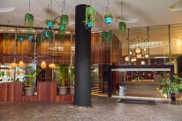 a building with plants from the ceiling