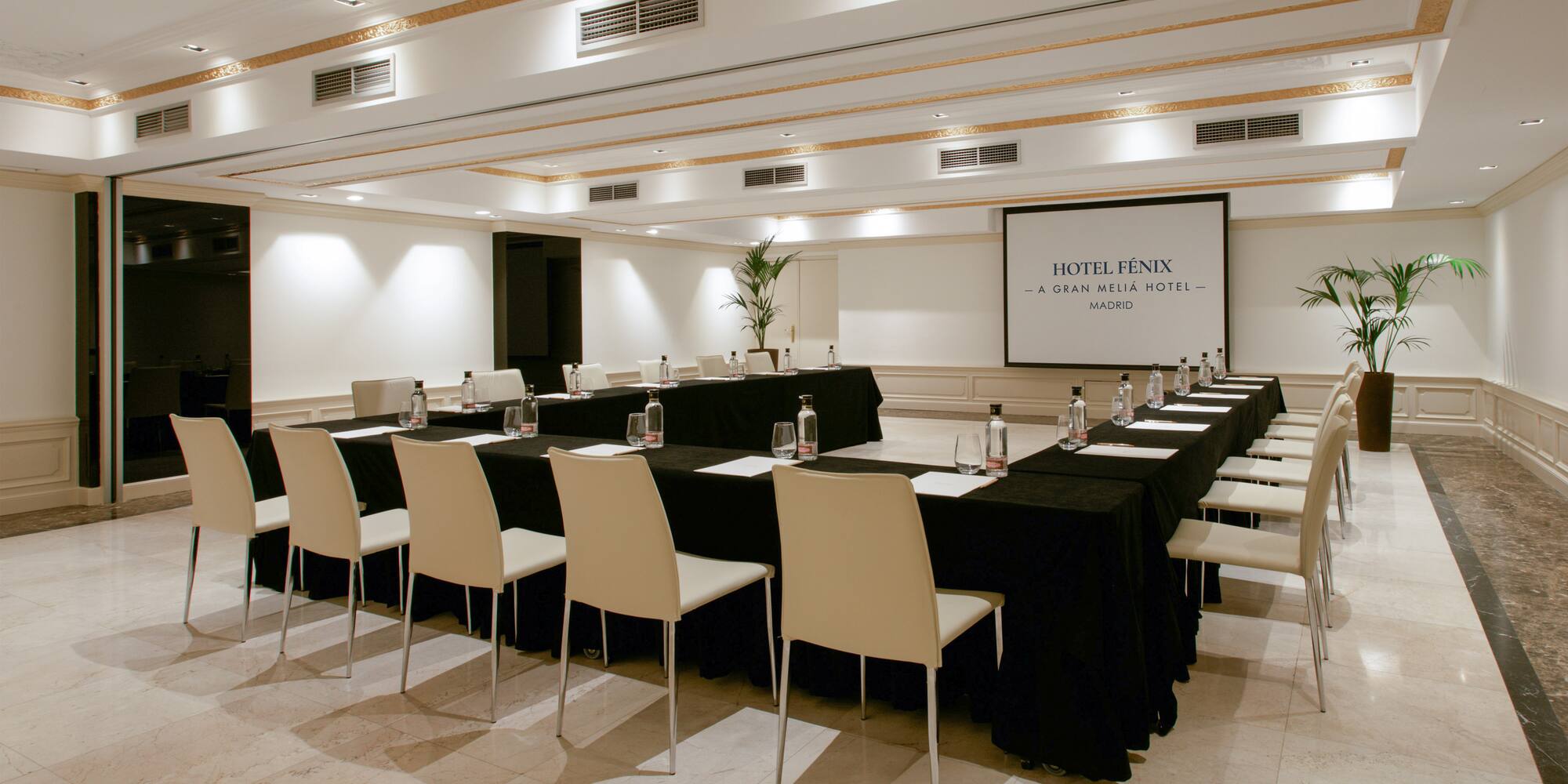 a room with a large table and chairs