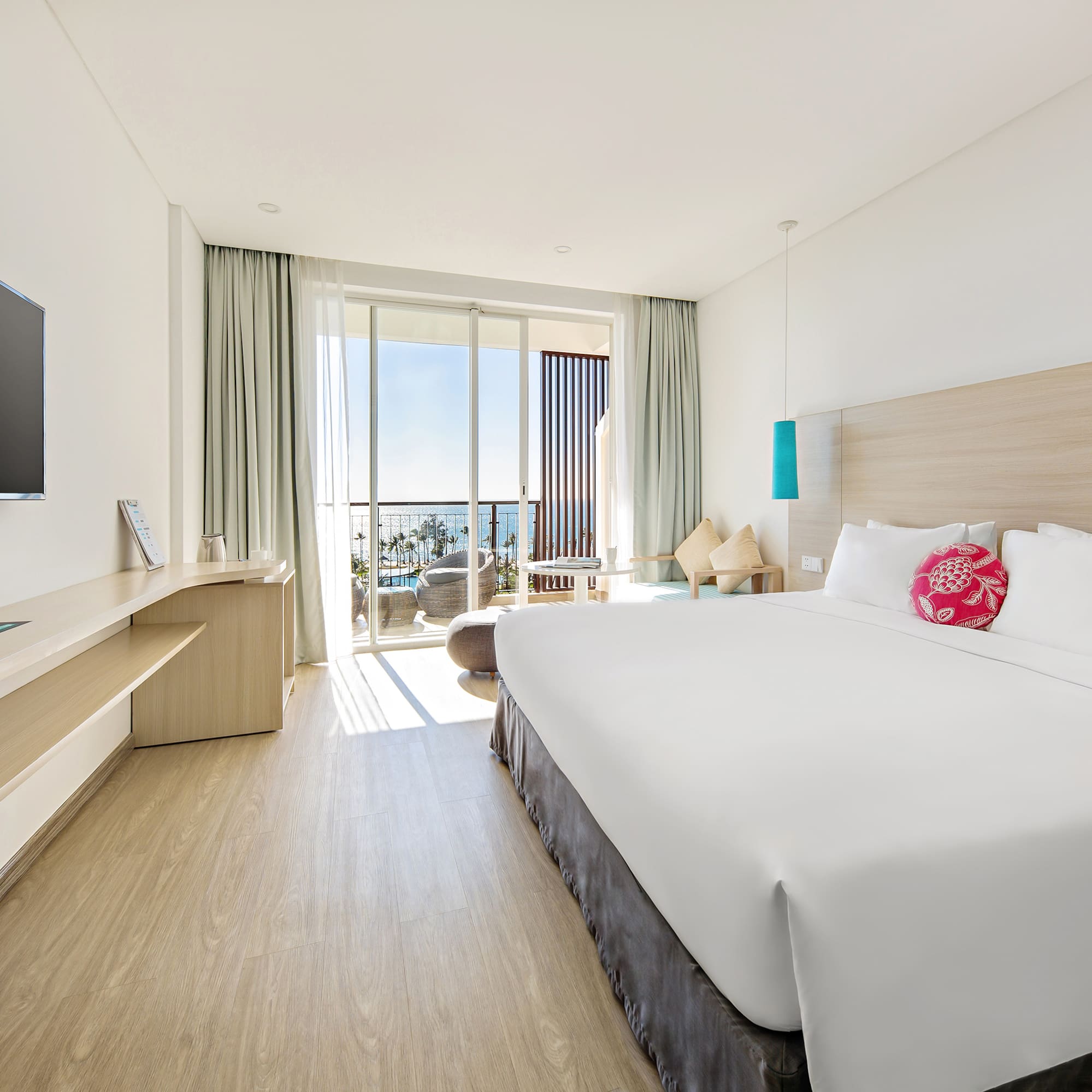 a room with a bed and a television